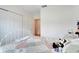 Charming bedroom featuring comfortable quilt, spacious closet, and soft natural light from the doorway at 641 Black Eagle Dr, Groveland, FL 34736