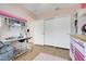 Bright and organized craft room featuring sewing machines, white cabinets and a large closet at 641 Black Eagle Dr, Groveland, FL 34736
