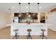 Bright kitchen with a spacious island with barstool seating and pendant lighting at 641 Black Eagle Dr, Groveland, FL 34736