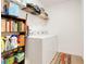 Functional laundry room featuring a washer and dryer, shelving, and storage space for cleaning supplies at 641 Black Eagle Dr, Groveland, FL 34736