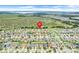 Aerial view shows the location of a home within a thriving community near a natural marshland area at 641 Black Eagle Dr, Groveland, FL 34736