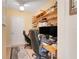 Spacious home office with a built-in desk and plenty of storage space with custom shelves at 641 Black Eagle Dr, Groveland, FL 34736