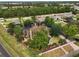 Aerial of the property in the neighborhood, showing landscaping and the surrounding area at 707 S Dixie Dr, Howey In The Hills, FL 34737