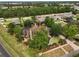 Aerial view of house, showing landscaping and neighborhood at 707 S Dixie Dr, Howey In The Hills, FL 34737