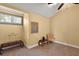 Cozy bedroom features window seat, carpet, and bright walls perfect for relaxing or reading at 707 S Dixie Dr, Howey In The Hills, FL 34737