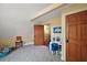 Playroom featuring carpet, overhead fan, neutral colored walls, and traditional wooden doors at 707 S Dixie Dr, Howey In The Hills, FL 34737