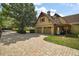 Long paved driveway leading to a two-car garage, with an adjacent covered area at 707 S Dixie Dr, Howey In The Hills, FL 34737