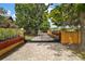 Gated driveway with brick pavers, manicured landscaping, and a charming two-story home at 707 S Dixie Dr, Howey In The Hills, FL 34737