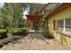 Exterior of home, brick-paved walkway and covered patio at 707 S Dixie Dr, Howey In The Hills, FL 34737