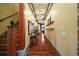 Bright and long hallway featuring wood floors, recessed lighting, and decorative trim at 707 S Dixie Dr, Howey In The Hills, FL 34737