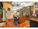Well-equipped kitchen featuring custom cabinets, an island with a granite countertop, and modern appliances at 707 S Dixie Dr, Howey In The Hills, FL 34737