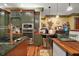Well-appointed kitchen with stainless steel appliances, a copper faucet, and wooden countertops at 707 S Dixie Dr, Howey In The Hills, FL 34737