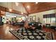 Open-concept living area featuring hardwood floors, a decorative rug, and views into the dining area at 707 S Dixie Dr, Howey In The Hills, FL 34737