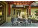 Outdoor patio features a table with chairs and a charming view of the backyard at 707 S Dixie Dr, Howey In The Hills, FL 34737