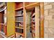 Hidden room behind a bookshelf for storage at 707 S Dixie Dr, Howey In The Hills, FL 34737