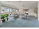 Bright and airy living room with large windows and neutral decor at 727 Turnberry Ln, The Villages, FL 32159