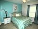 Comfortable bedroom with a queen bed, ceiling fan, and bright, natural light at 751 Old Oaks Ln, Leesburg, FL 34748