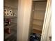 Well-stocked pantry featuring wire shelving with ample storage for food and household items at 751 Old Oaks Ln, Leesburg, FL 34748