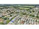 Lush residential community featuring well-maintained homes, mature trees, and verdant green spaces at 8039 Se 174Th Belhaven Loop, The Villages, FL 32162