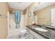 Cozy bathroom features shower/tub combo and granite countertop vanity at 8039 Se 174Th Belhaven Loop, The Villages, FL 32162