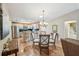 Open dining area with stainless steel appliances, island, and a view of the kitchen at 8039 Se 174Th Belhaven Loop, The Villages, FL 32162