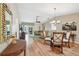 Inviting dining room with hardwood floors, chandelier, and ample natural light at 8039 Se 174Th Belhaven Loop, The Villages, FL 32162