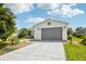 Charming single Gathering home with an attached garage and well manicured lawn at 8039 Se 174Th Belhaven Loop, The Villages, FL 32162