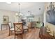 Open floor plan with a view of the dining area and cozy living room furniture at 8039 Se 174Th Belhaven Loop, The Villages, FL 32162