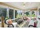 Bright and airy sunroom filled with comfortable seating and natural light at 8039 Se 174Th Belhaven Loop, The Villages, FL 32162