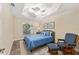 Bedroom with a ceiling fan, window, and comfortable seating area offering a cozy retreat at 832 Parrish Pl, The Villages, FL 32163