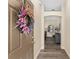 Inviting foyer featuring an arched doorway, stylish decor, and elegant wood-look flooring at 832 Parrish Pl, The Villages, FL 32163