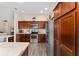 Spacious kitchen with stainless steel appliances, ample cabinet space, and modern lighting at 832 Parrish Pl, The Villages, FL 32163