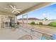 Relaxing screened-in lanai with ceiling fan and comfortable seating, perfect for enjoying the outdoors at 832 Parrish Pl, The Villages, FL 32163