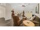 Open-concept living space with a seamless flow between the living room, dining area, and kitchen, perfect for modern living at 832 Parrish Pl, The Villages, FL 32163