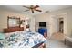 Comfortable bedroom featuring a decorative ceiling fan and a doorway view to the Gathering room at 8639 Se 141St Pl, Summerfield, FL 34491