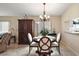 Dining room with a chandelier, tile floors, and natural light at 8639 Se 141St Pl, Summerfield, FL 34491