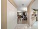View of foyer flowing into the living room, dining area, and kitchen of the home at 8639 Se 141St Pl, Summerfield, FL 34491