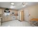 Functional kitchen with white cabinetry, a ceiling fan, and tiled floors at 8639 Se 141St Pl, Summerfield, FL 34491