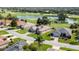 Aerial view of home featuring lush golf course and pond views at 9059 Se 177Th Grassmere St, The Villages, FL 32162