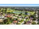 Aerial view of a home in a golf community at 9059 Se 177Th Grassmere St, The Villages, FL 32162