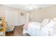 Comfortable bedroom includes a ceiling fan, natural light, and closet space at 9059 Se 177Th Grassmere St, The Villages, FL 32162