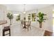 Cozy breakfast nook with tile floor and large bright windows at 9059 Se 177Th Grassmere St, The Villages, FL 32162