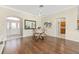 Open-concept dining area with hardwood floors and an adjacent doorway to the kitchen at 9059 Se 177Th Grassmere St, The Villages, FL 32162