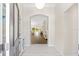 Inviting foyer featuring tile flooring and an arched entryway to the bright and open living spaces at 9059 Se 177Th Grassmere St, The Villages, FL 32162