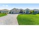 Inviting single-story home with well-manicured lawn and landscaping at 9059 Se 177Th Grassmere St, The Villages, FL 32162