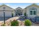 Charming home with a paver driveway, manicured landscaping, and a cozy front patio at 9059 Se 177Th Grassmere St, The Villages, FL 32162
