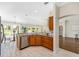 Well-lit kitchen boasts granite countertops, stainless steel appliances, and a breakfast nook with bright windows at 9059 Se 177Th Grassmere St, The Villages, FL 32162