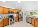 Updated kitchen showcases stainless steel appliances and eat-in breakfast bar at 9059 Se 177Th Grassmere St, The Villages, FL 32162