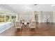 Open living room with hard wood floors and patio access at 9059 Se 177Th Grassmere St, The Villages, FL 32162