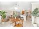 Bright, open floor plan showcases the breakfast nook, living room, and modern kitchen at 9059 Se 177Th Grassmere St, The Villages, FL 32162